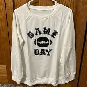 Brand New!! Never worn. White long sleeve Game Day sweater. Size Medium